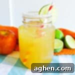 Apple Cider Margarita in mason jar with sugared rim and lime garnish