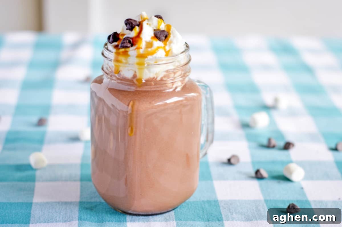 Hot Chocolate with caramel vodka, topped with whipped cream and caramel sauce