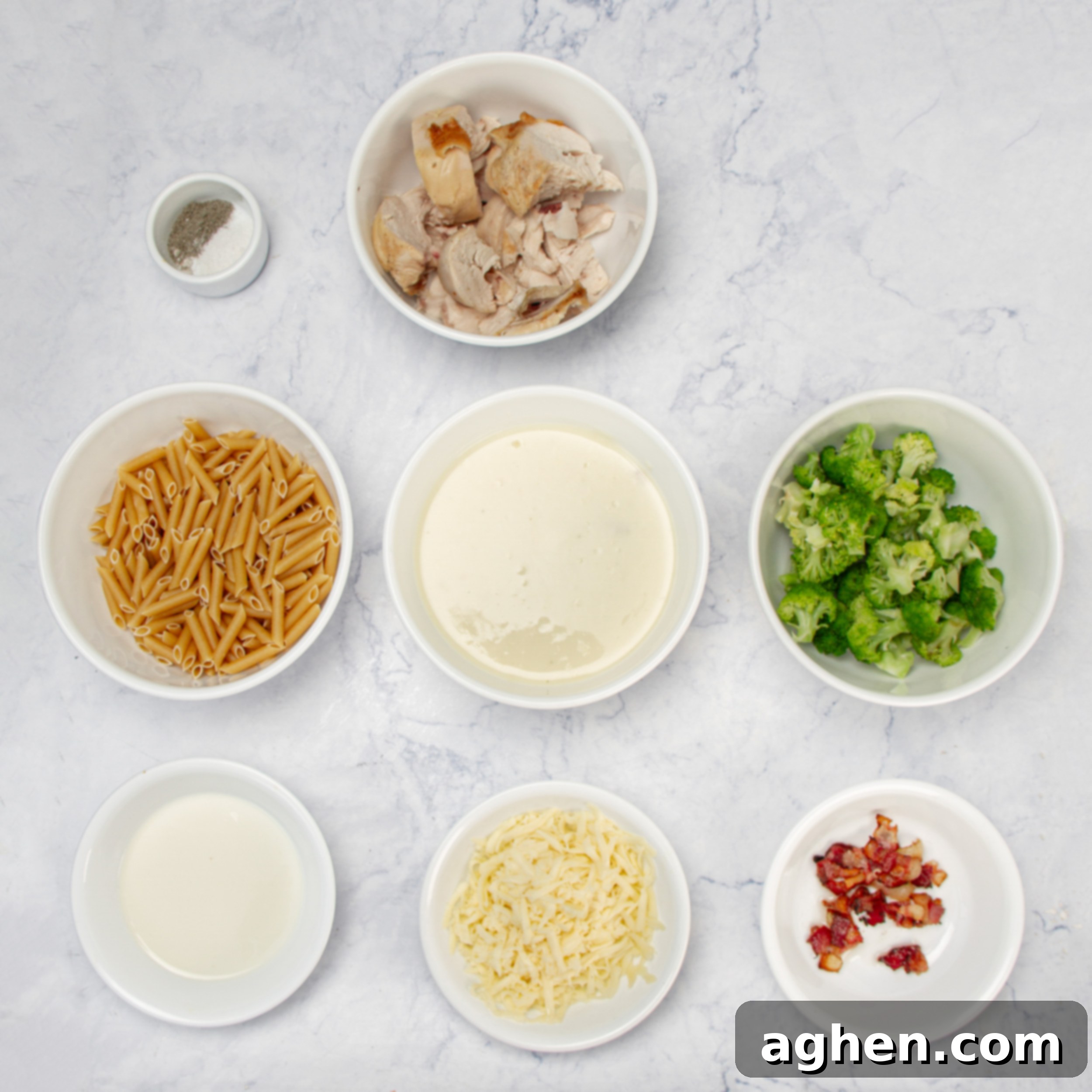 Chicken Bacon Alfredo Pasta Bake 3 Chicken Bacon Alfredo Pasta Bake ingredients in separate dishes.