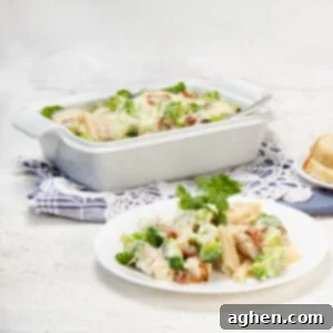 Chicken Bacon Alfredo Pasta Bake 7 Rich, creamy, and satisfying—Chicken bacon alfredo pasta bake in a casserole dish, ready for eating!