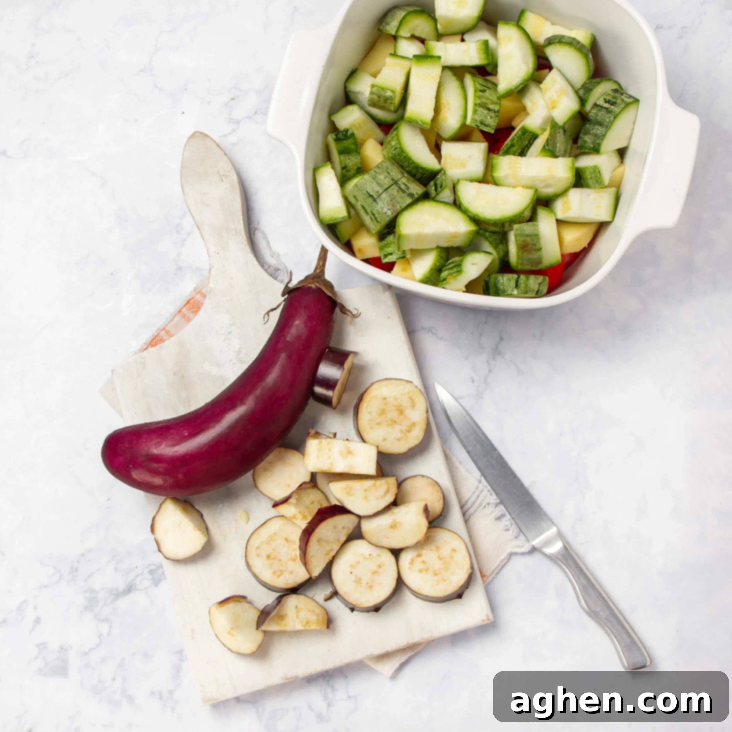 Greek Vegetable Casserole Your Weight Watchers Go-To 4 Vegetables being chopped on a cutting board.