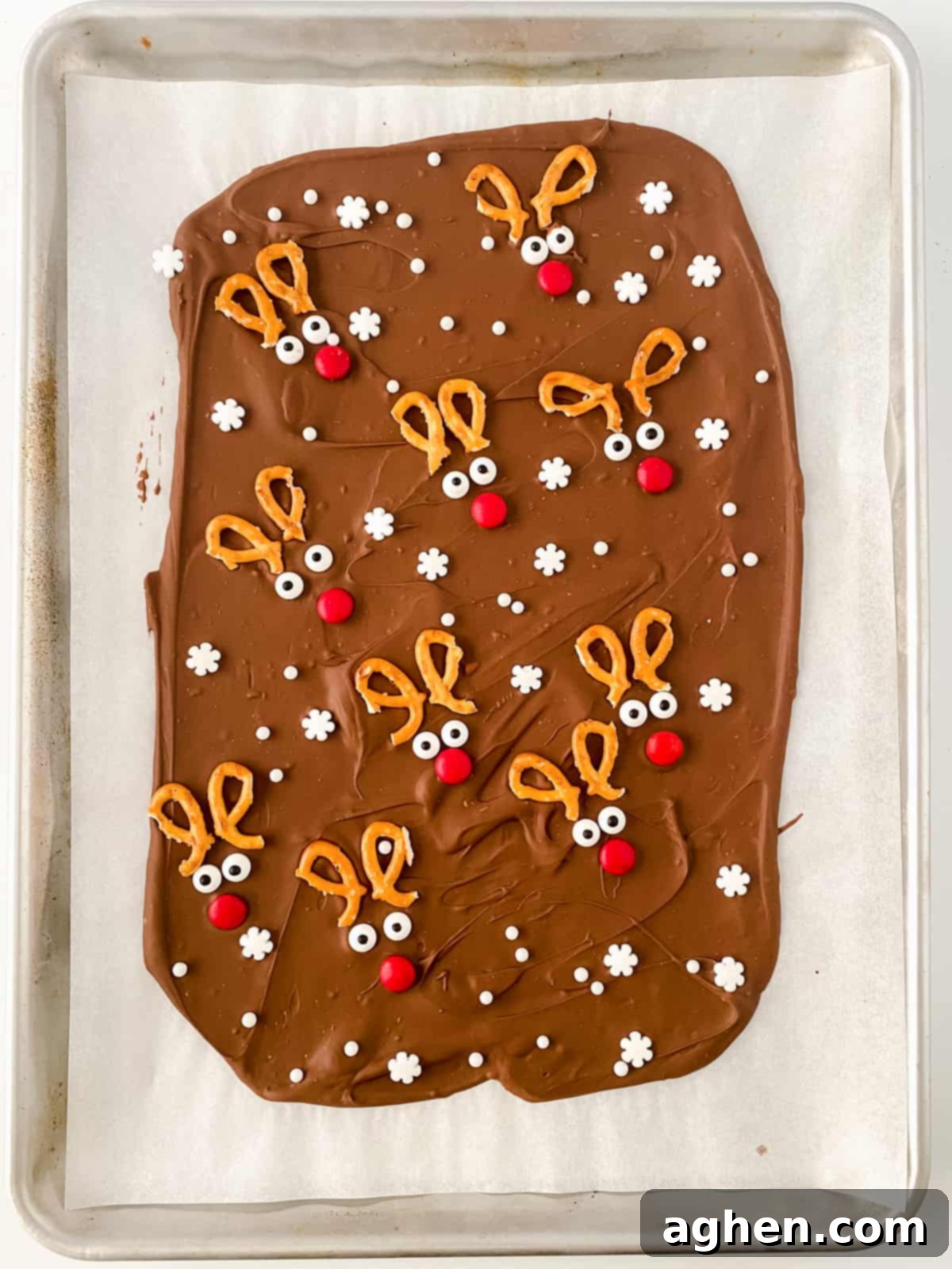 Set Reindeer Bark on parchment paper, ready to be broken into individual festive pieces.