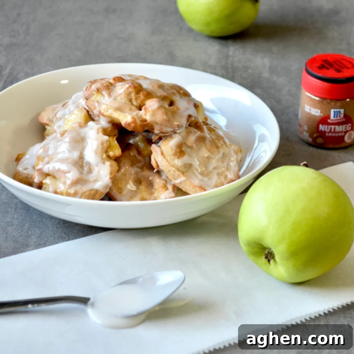 Perfect Air Fryer Apple Fritters 2 Bowl of air fryer apple fritters with glaze