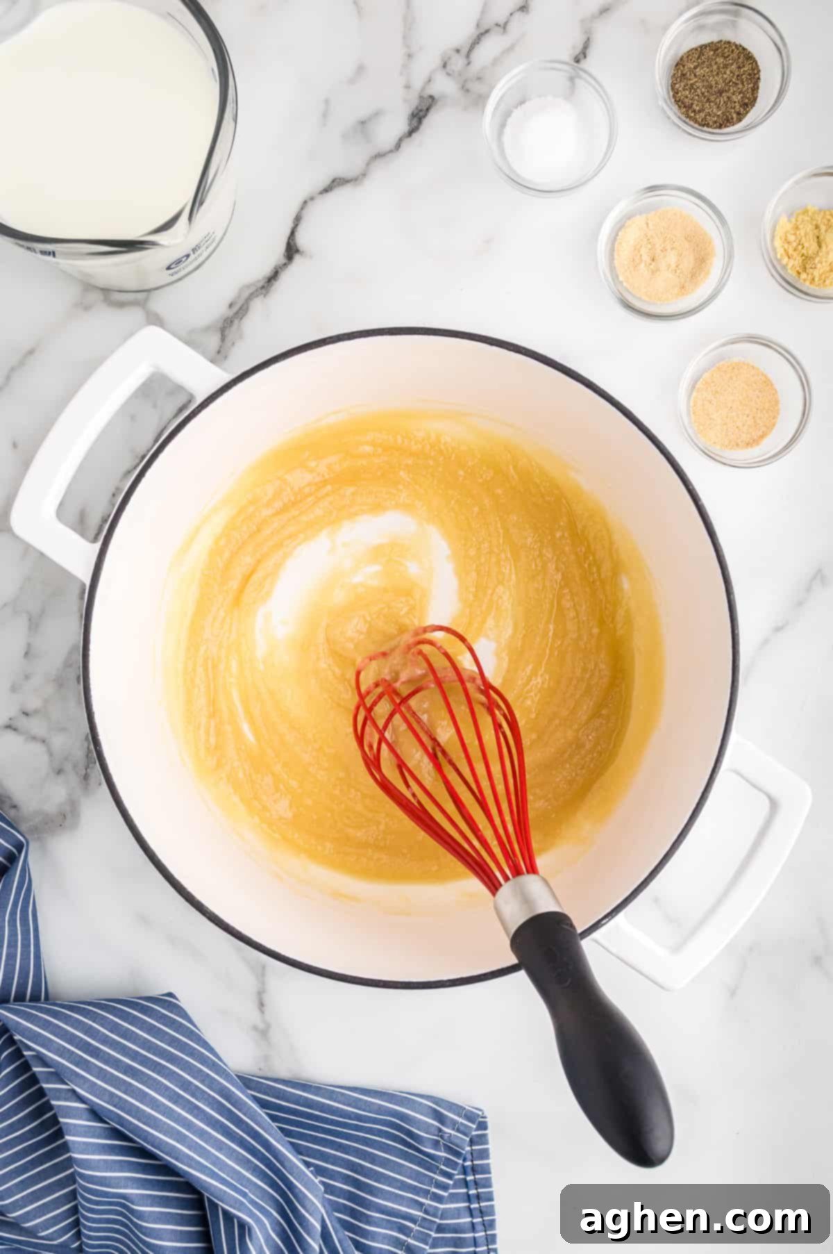 Whisking flour into melted butter with a whisk