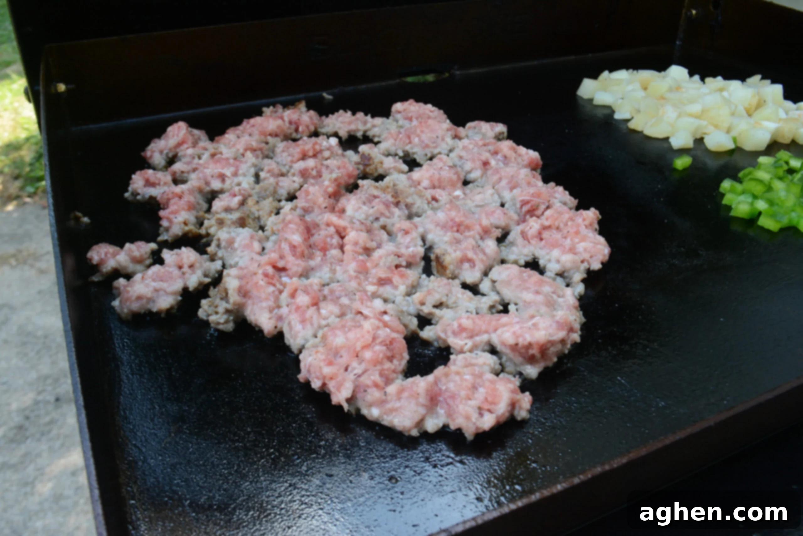 A close up of breakfast sausage that is not finished cooking on the Blackstone.