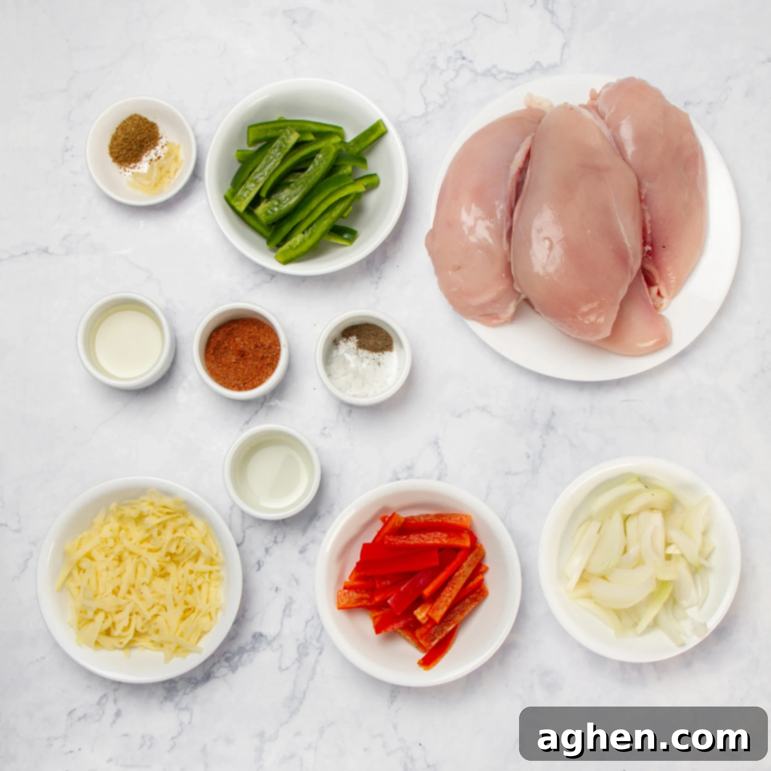 Bell Pepper Chicken Casserole ingredients in separate dishes on a counter, including chicken, seasonings, and sliced vegetables.