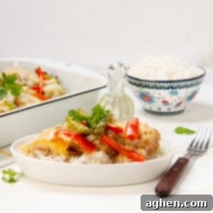 Cheesy Bell Pepper Chicken Casserole on a plate with a fork, ready to be enjoyed.