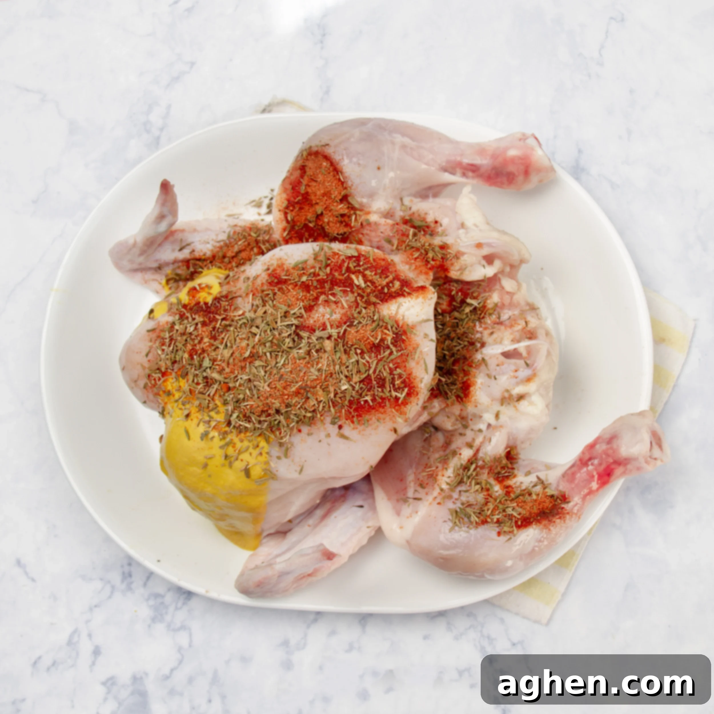 Easy Slow Cooker Whole Chicken 5 Spices spread over the raw whole chicken to marinate.
