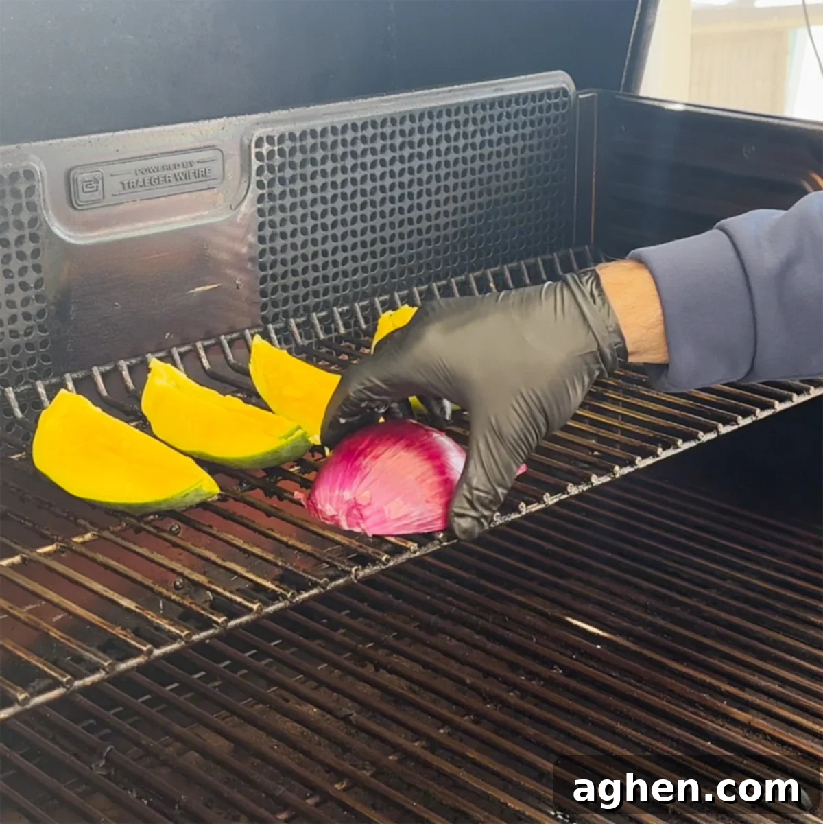 Mango and red onion smoking on a Traeger grill