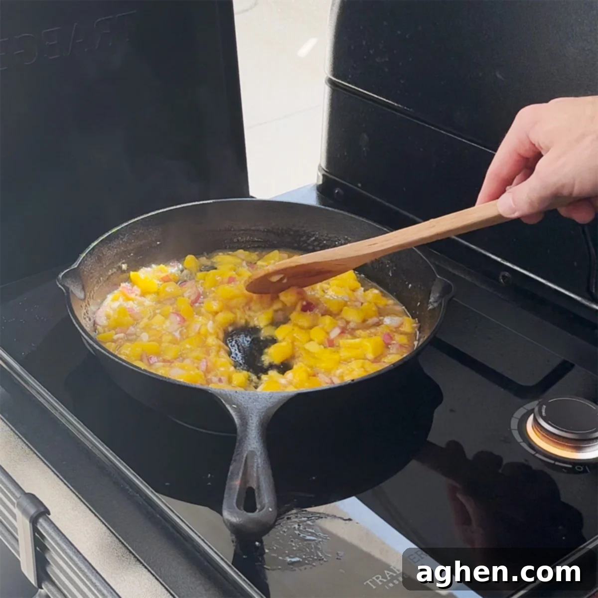 Smoked Mango Chutney simmering in a cast iron pan