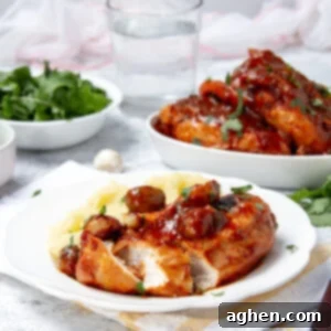 Rustic Chicken Chasseur served on a plate with the remaining chicken in a serving platter in the background.