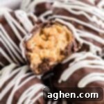 No-Bake Peanut Butter Crunch Bites 12 Peanut Butter Ball with Rice Krisipes cut in half to show creamy peanut butter and crunchy texture.