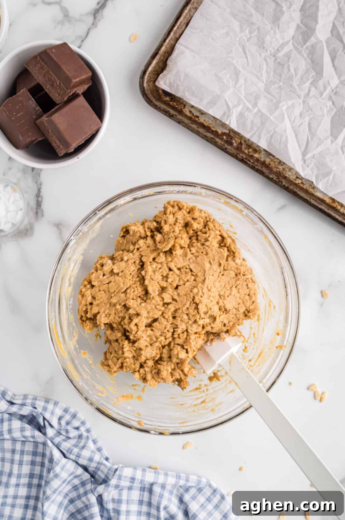 No-Bake Peanut Butter Crunch Bites 5 Peanut Butter Ball Mixture with Rice Krispies in a mixing bowl, ready to be rolled.