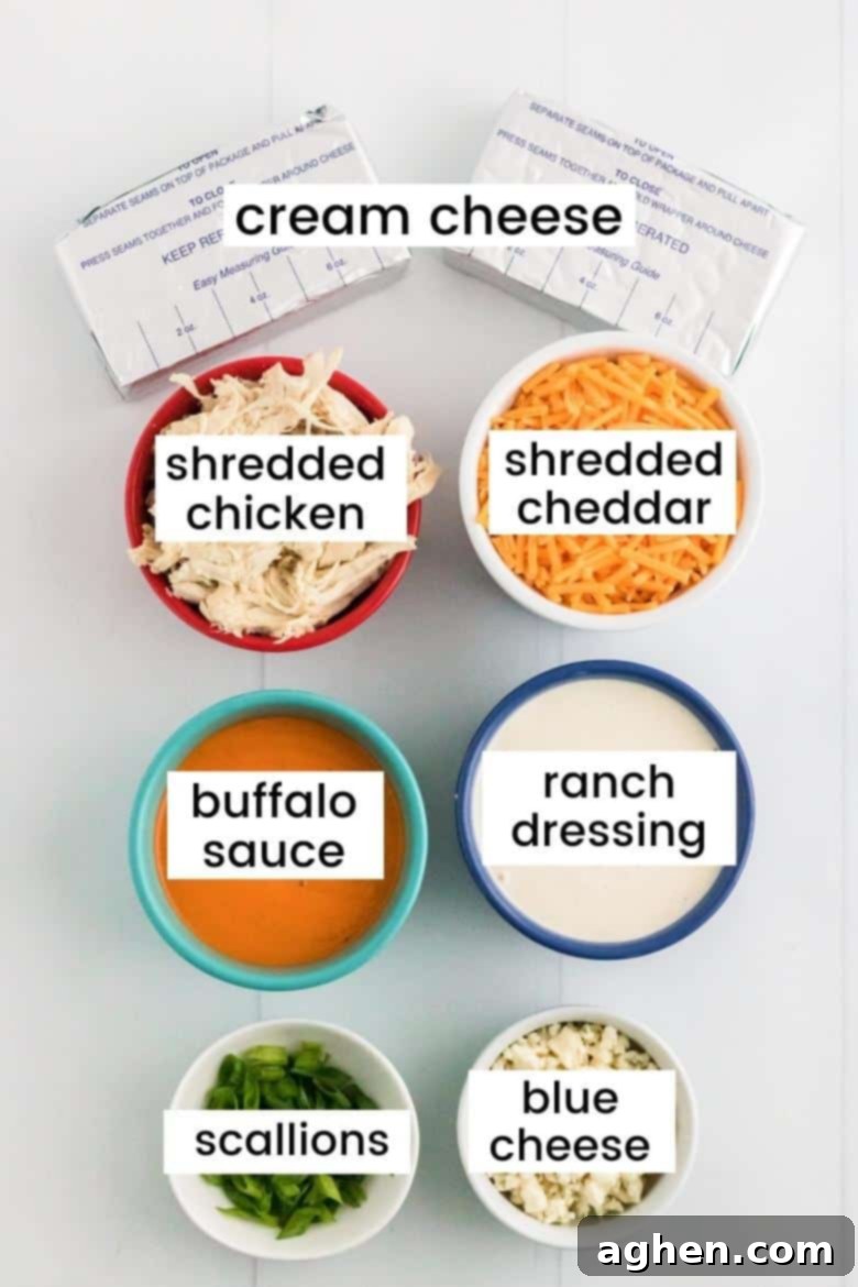 2 blocks of cream cheese, shredded cooked chicken, shredded cheese, buffalo sauce, ranch dressing, scallions, blue cheese crumbles.
