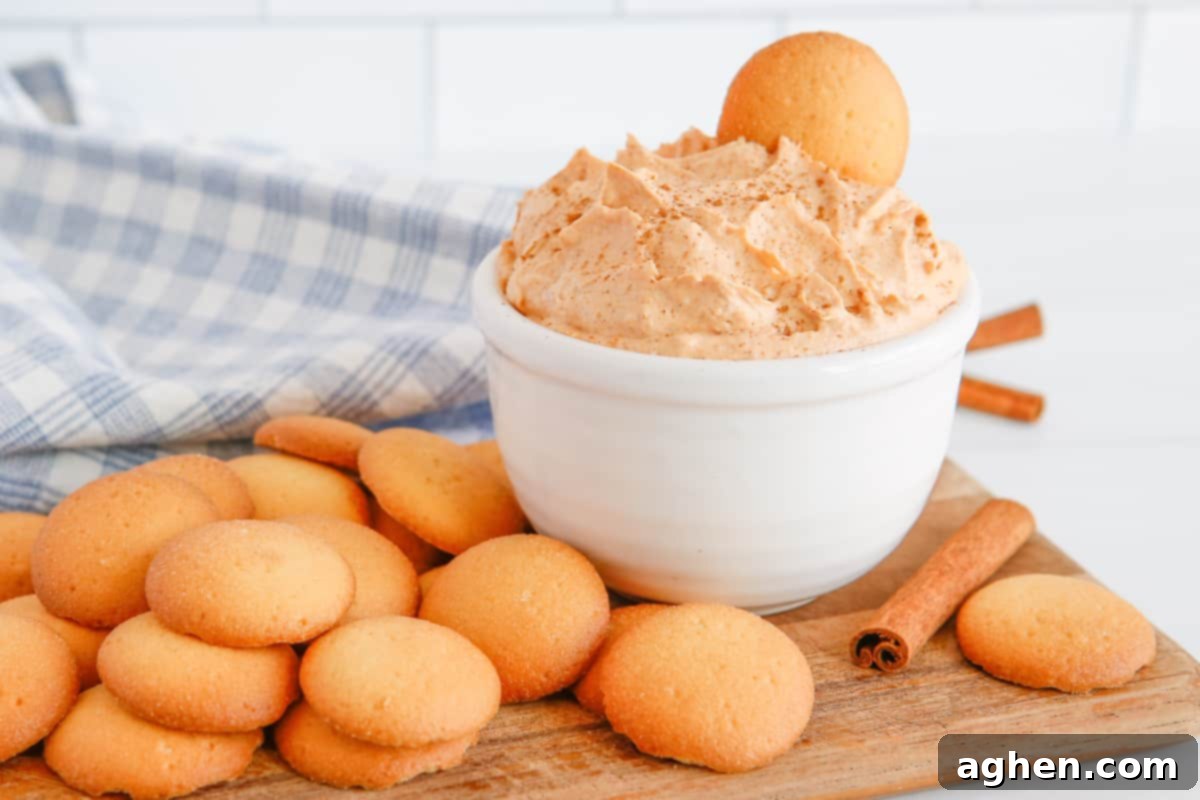 Pumpkin fluff dip served with vanilla cookies for dipping