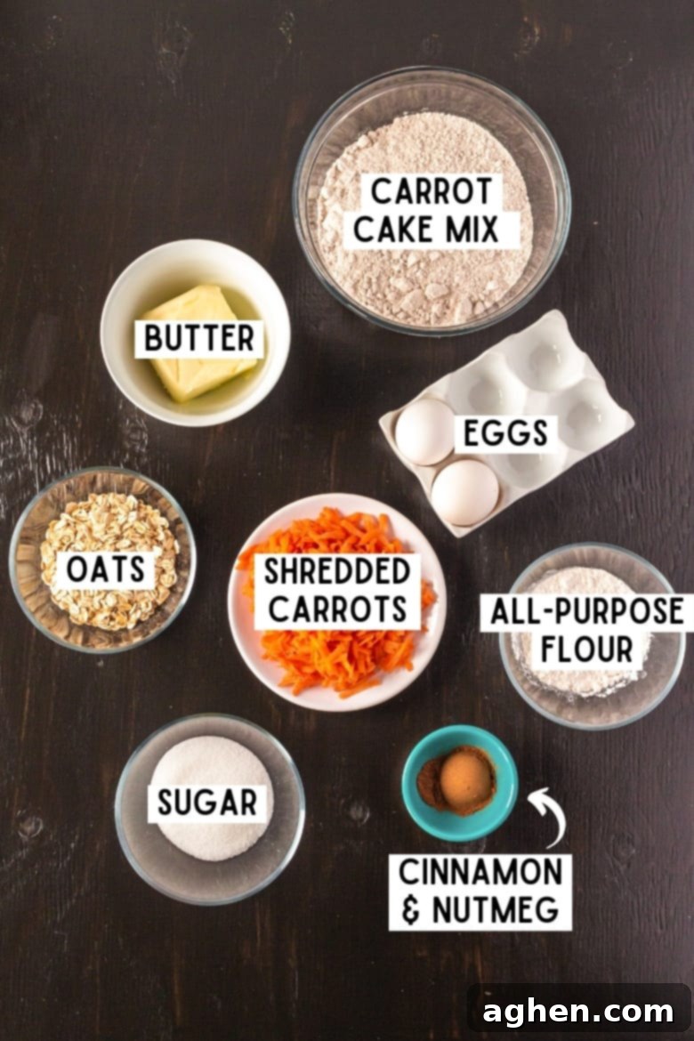 A flat lay of all the dry and wet ingredients needed for the carrot cake mix cookies, including carrot cake mix, eggs, butter, shredded carrots, all-purpose flour, granulated sugar, oats, cinnamon, and nutmeg.
