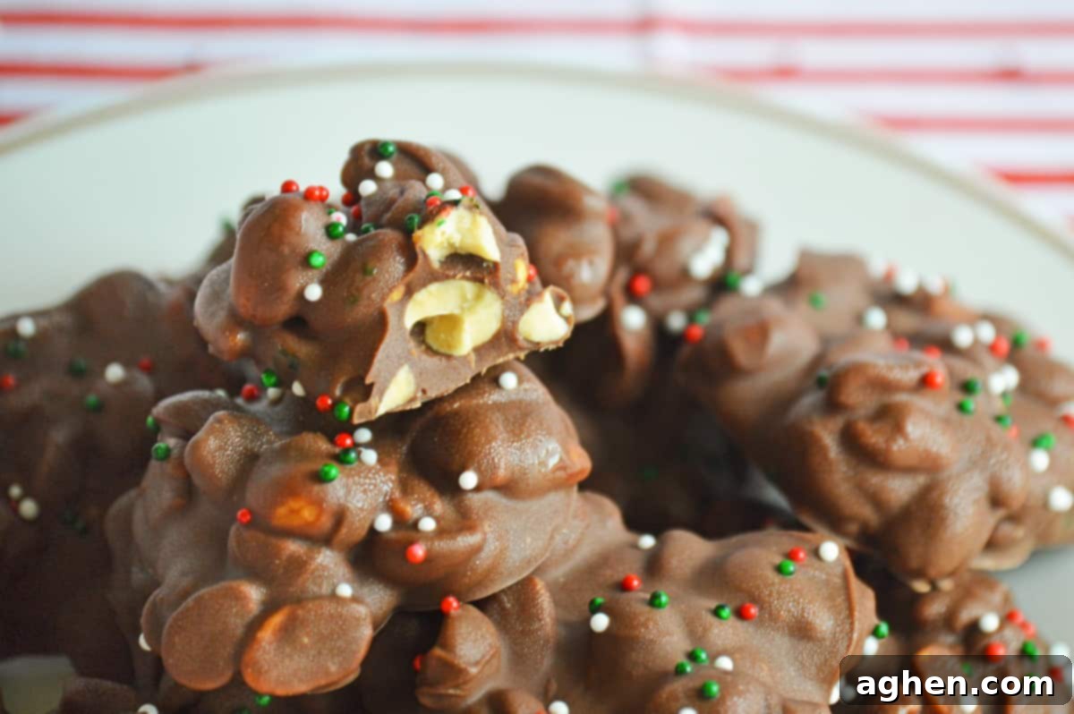 Plate of christmas crockpot candy with a bite taken out fo one cluster to show the peanuts