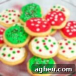 Tender Holiday Frosted Cookies 12 Platter of round frosted sugar cookies decorated with red, green, and white frosting and christmas sprinkles