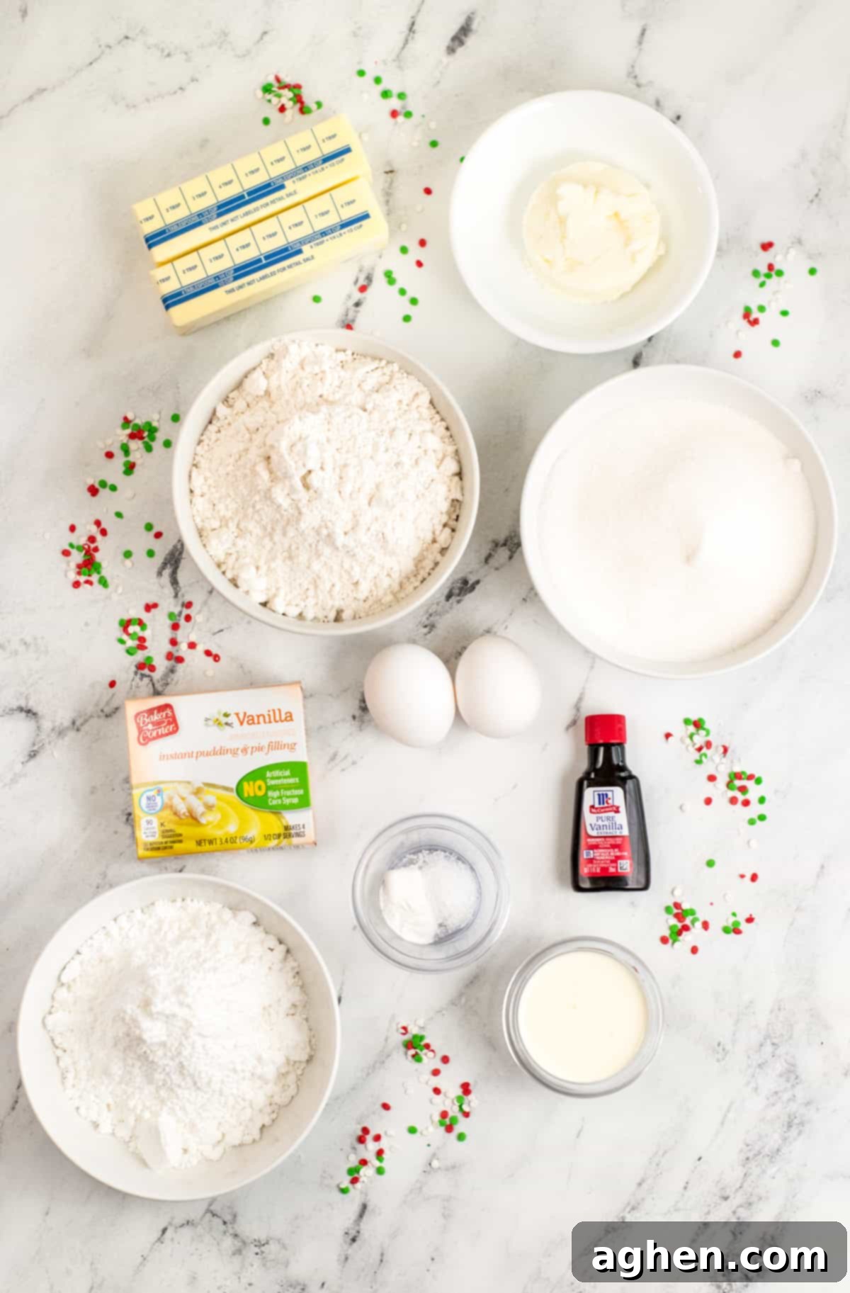 Tender Holiday Frosted Cookies 4 2 sticks of butter, shortening, flour, granulated sugar, vanilla pudding mix, vanilla extract, 2 eggs, powdered sugar, baking powder, salt, heavy cream, and sprinkles on countertop