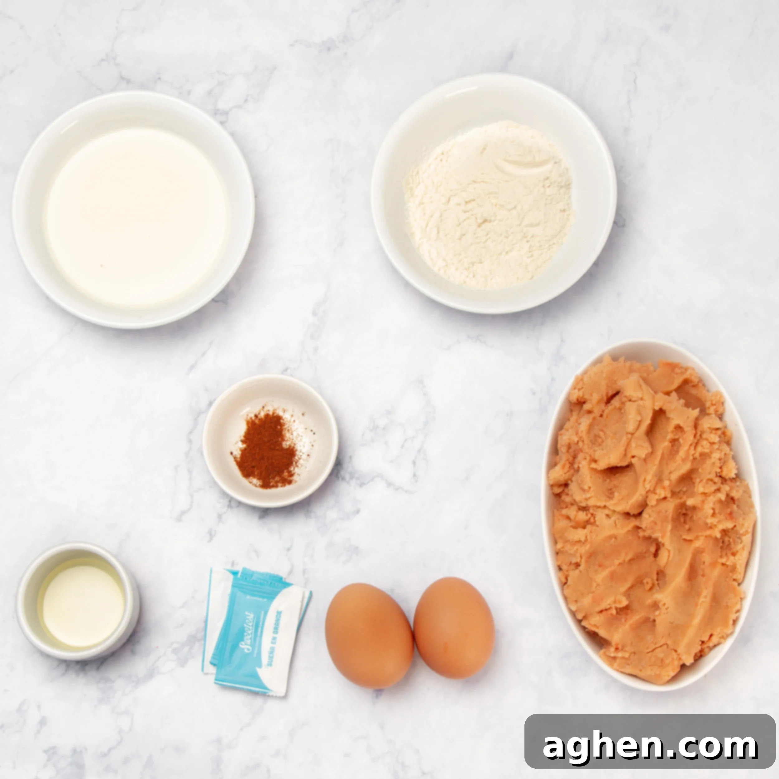 Golden Sweet Potato Pancakes 3 Sweet Potato Pancake ingredients displayed separately in small dishes on a kitchen counter, ready for preparation.