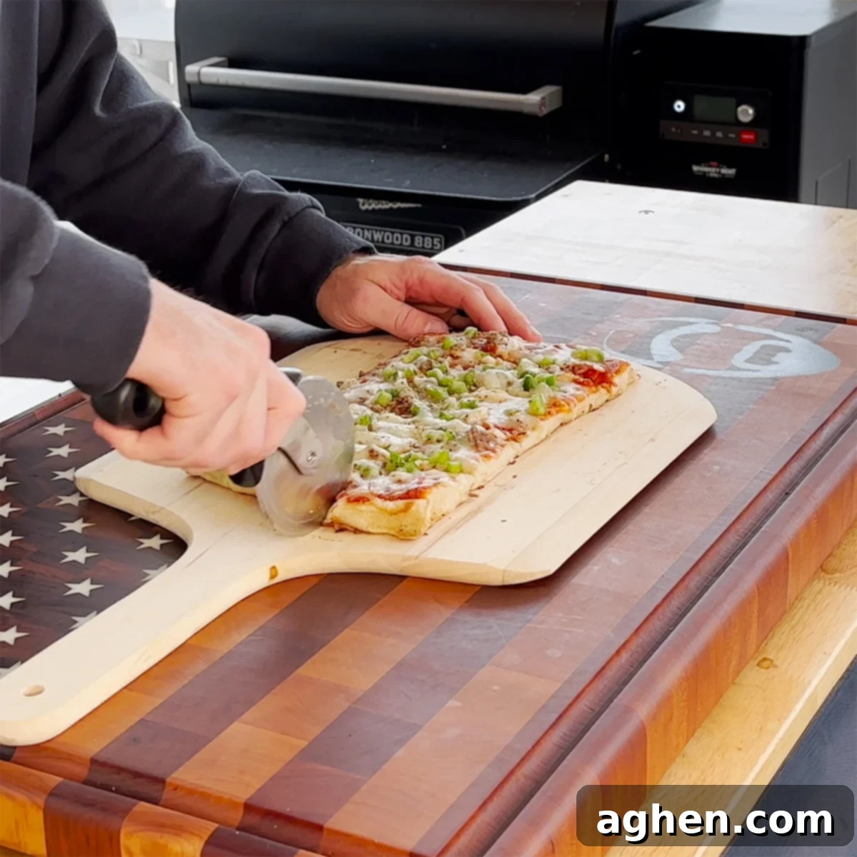Griddle Pizza: My New Culinary Addiction 8 A freshly cooked griddle pizza on a cutting board, being sliced with a pizza cutter.