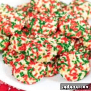 Soft vanilla pudding cookies with Christmas sprinkles on white serving platter