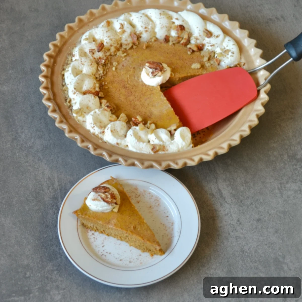 A whole Weight Watchers Crustless Pumpkin Pie next to a perfectly portioned slice, ready to be enjoyed.