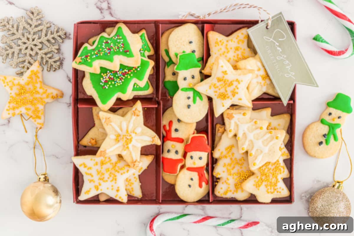 Christmas tree, snowman, and star shaped Cut out Christmas cookies arranged in serving box