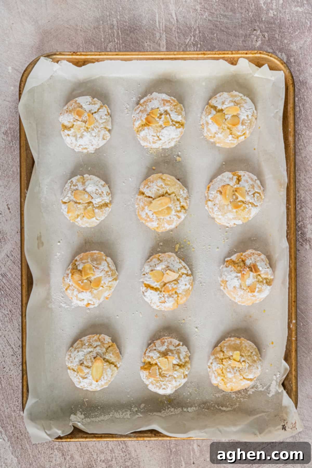 Amaretti cookies on parchment-lined baking sheet
