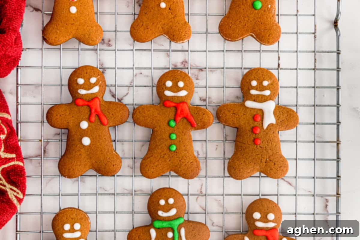 Decorated gingerbread men cookies on cooling rack