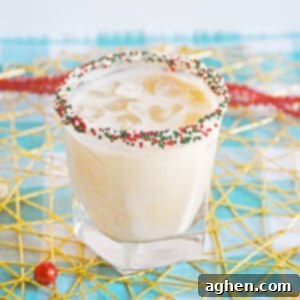 Christmas Cookie Cocktail with vodka in a christmas sprinkle rimmed glass