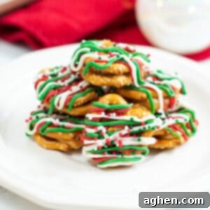 caramel pretzel bites drizzled with green, red, and white chocolate and topped with holiday sprinkles