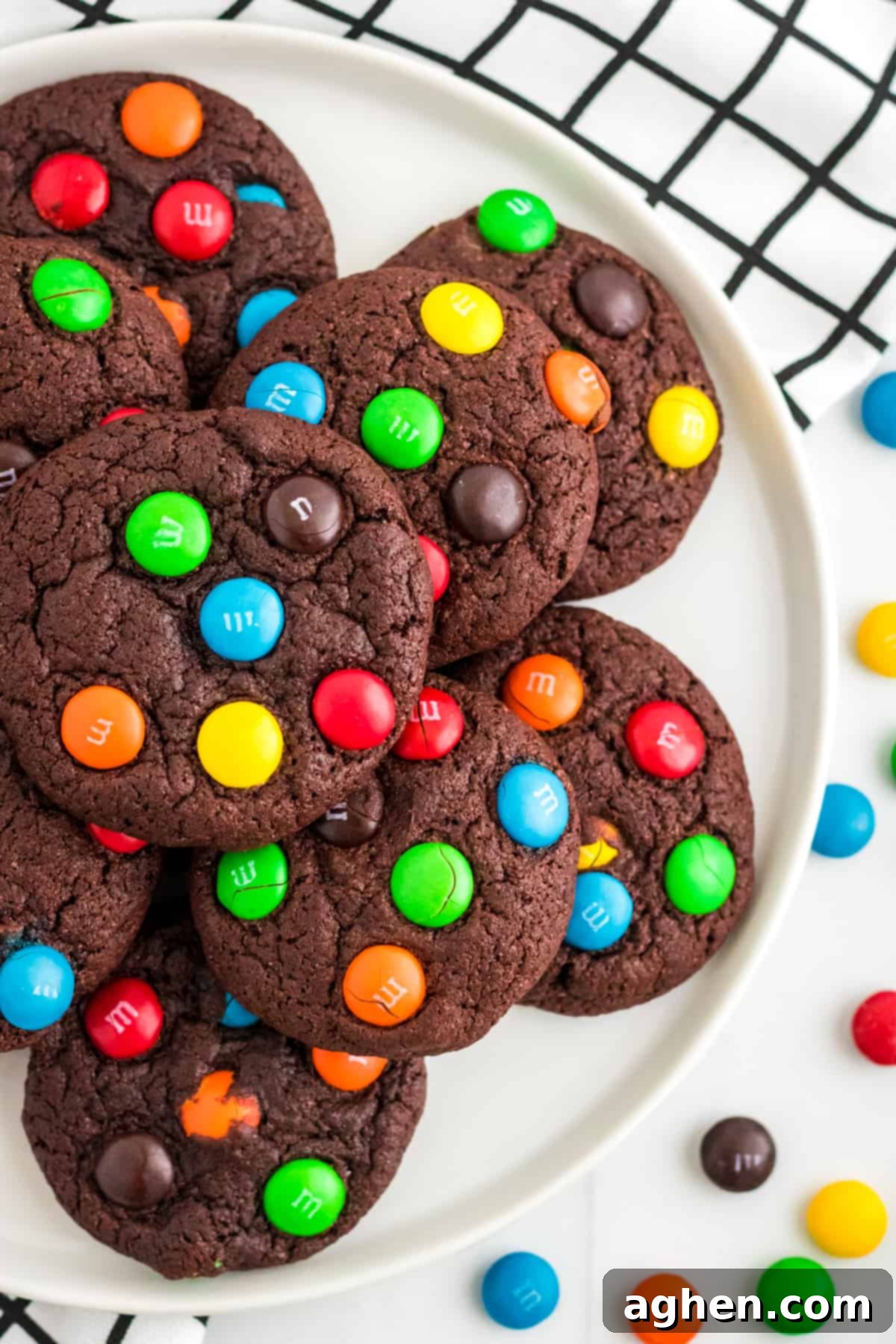 Easy M&M Chocolate Cake Mix Cookies 9 Chocolate cake mix cookies with M&Ms in them, perfectly stacked and ready for storage or serving.