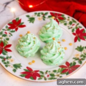 Christmas Tree Meringues - Green meringue cookies topped with gold star and gold sprinkles