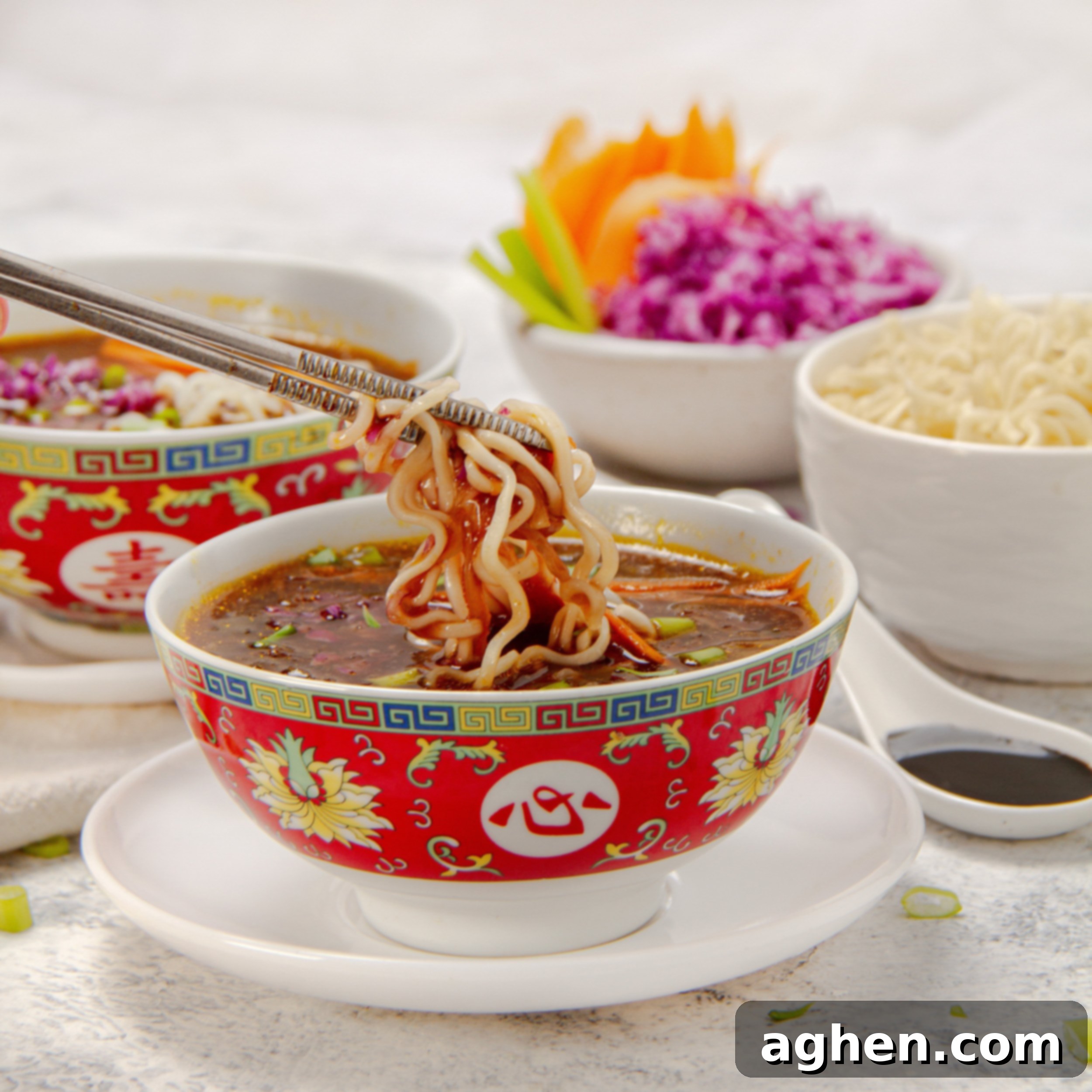 Manchow Soup: A Flavor Explosion 2 Thick and chunky Asian-inspired Manchow Soup in a bowl with noodles held up with chopsticks.