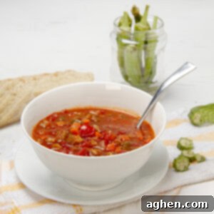 Authentic Okra Goodness 7 Hearty and nutritions Okra Soup in a bowl with a spoon.