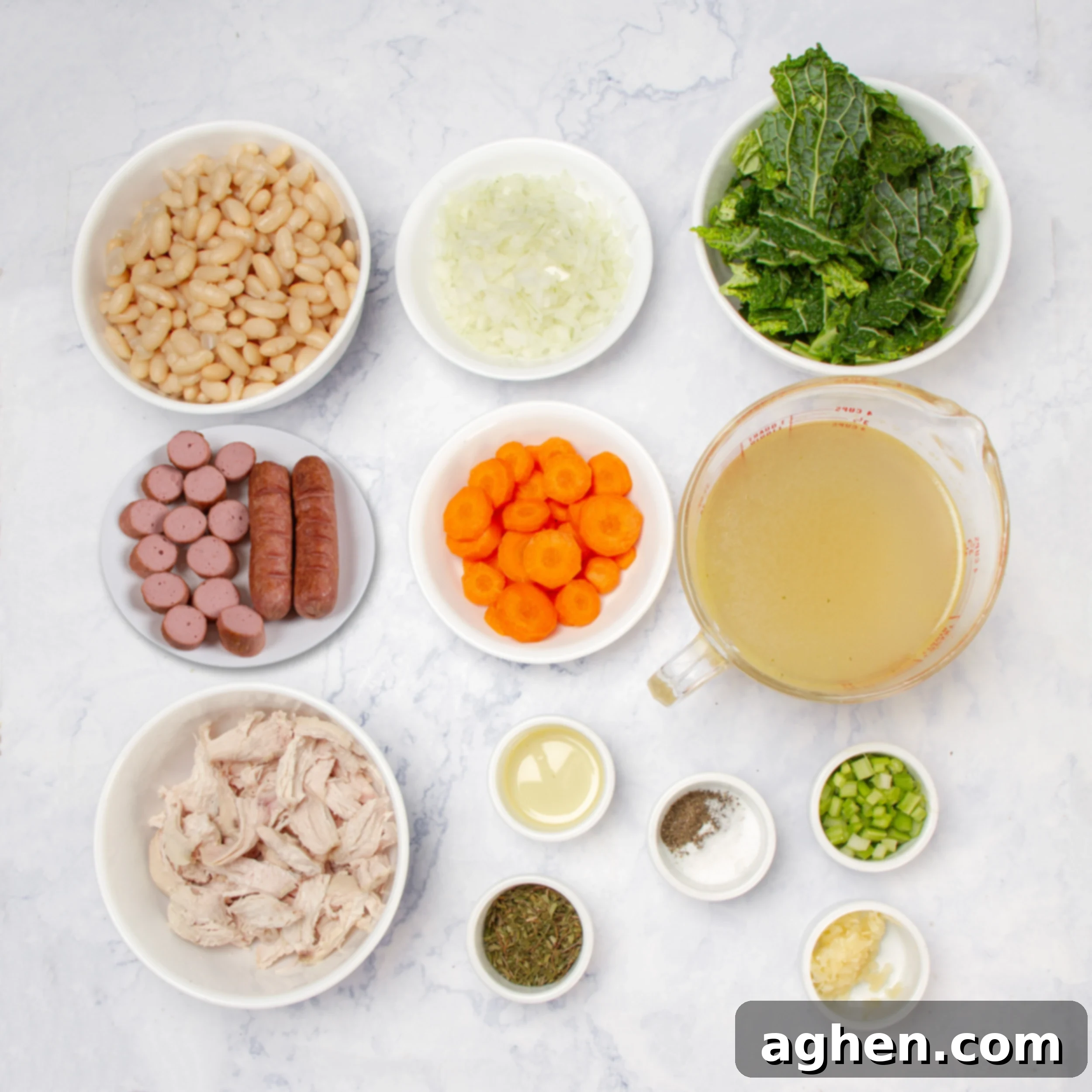 Hearty Portuguese Kale Soup 3 A collection of fresh Portuguese Kale Soup ingredients laid out in separate dishes on a kitchen counter.