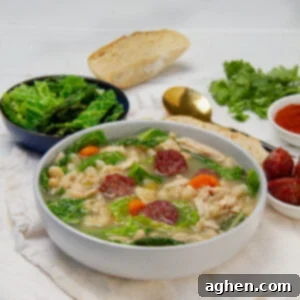 Hearty Portuguese Kale Soup 7 Thick and hearty Portuguese Kale Soup with white beans in a bowl.