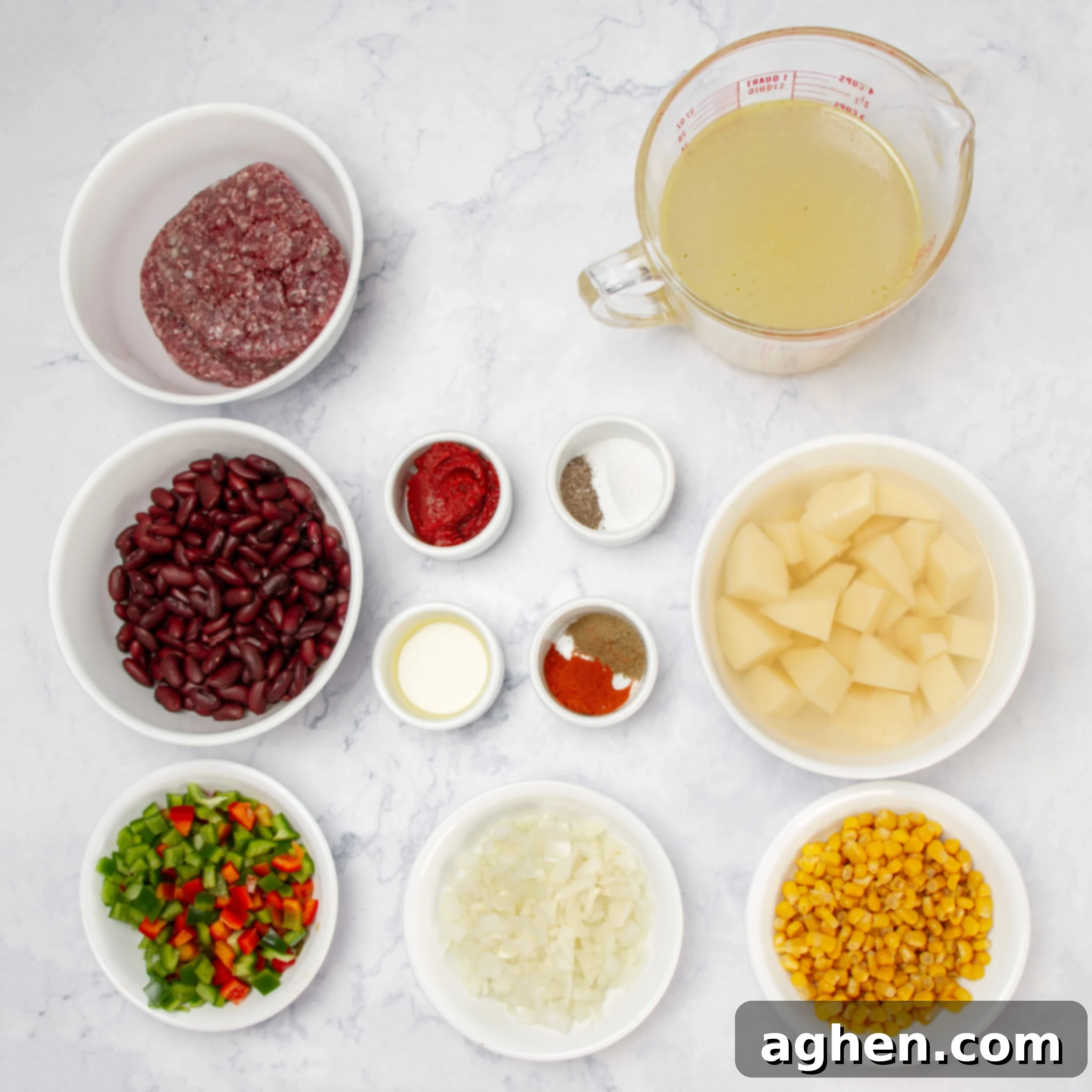 Cowboy Soup ingredients neatly arranged in separate dishes on a rustic counter, ready for preparation.