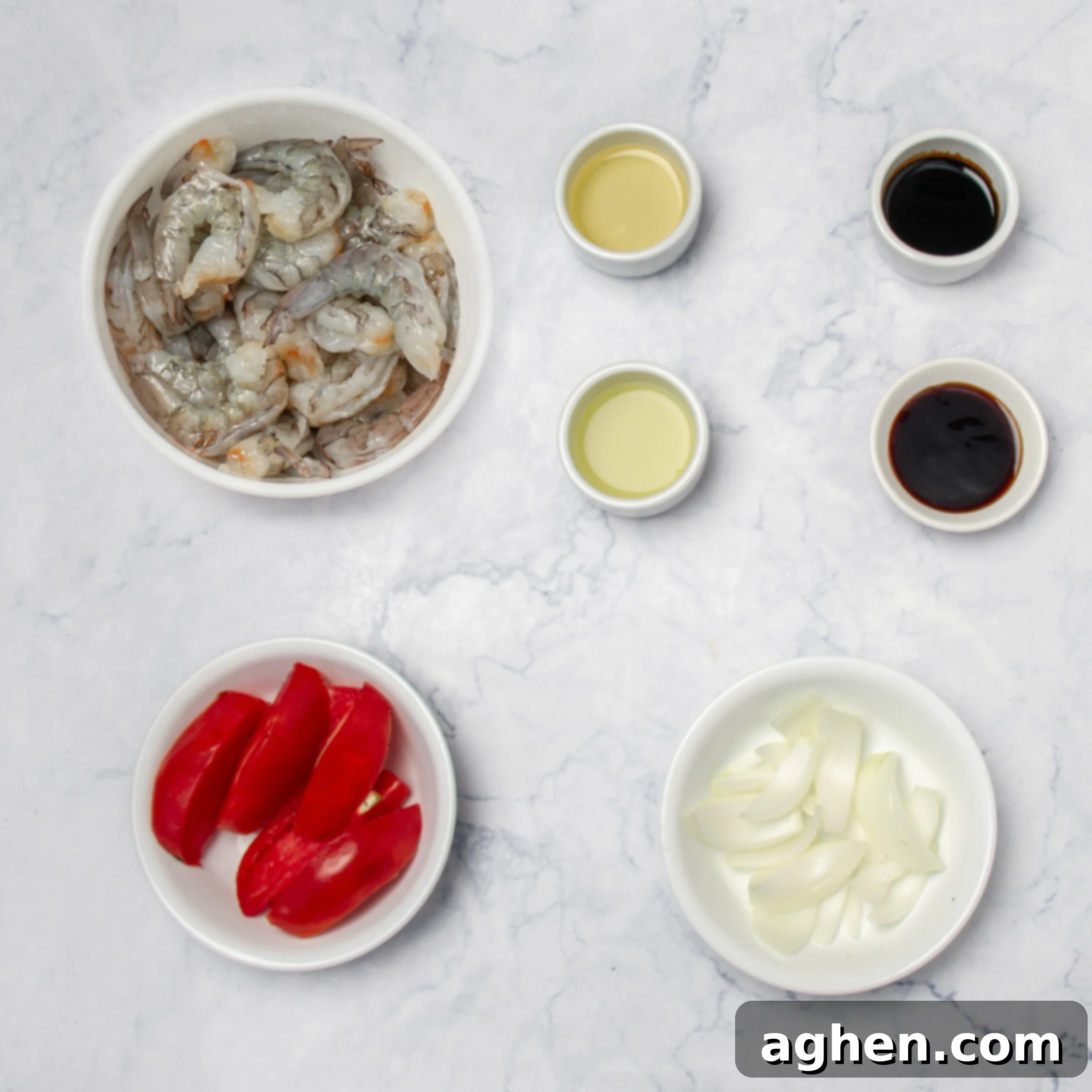 Tom Yum Soup 4 Remaining Tom Yum Soup ingredients, including fresh shrimp, tomatoes, and onion, in separate dishes.