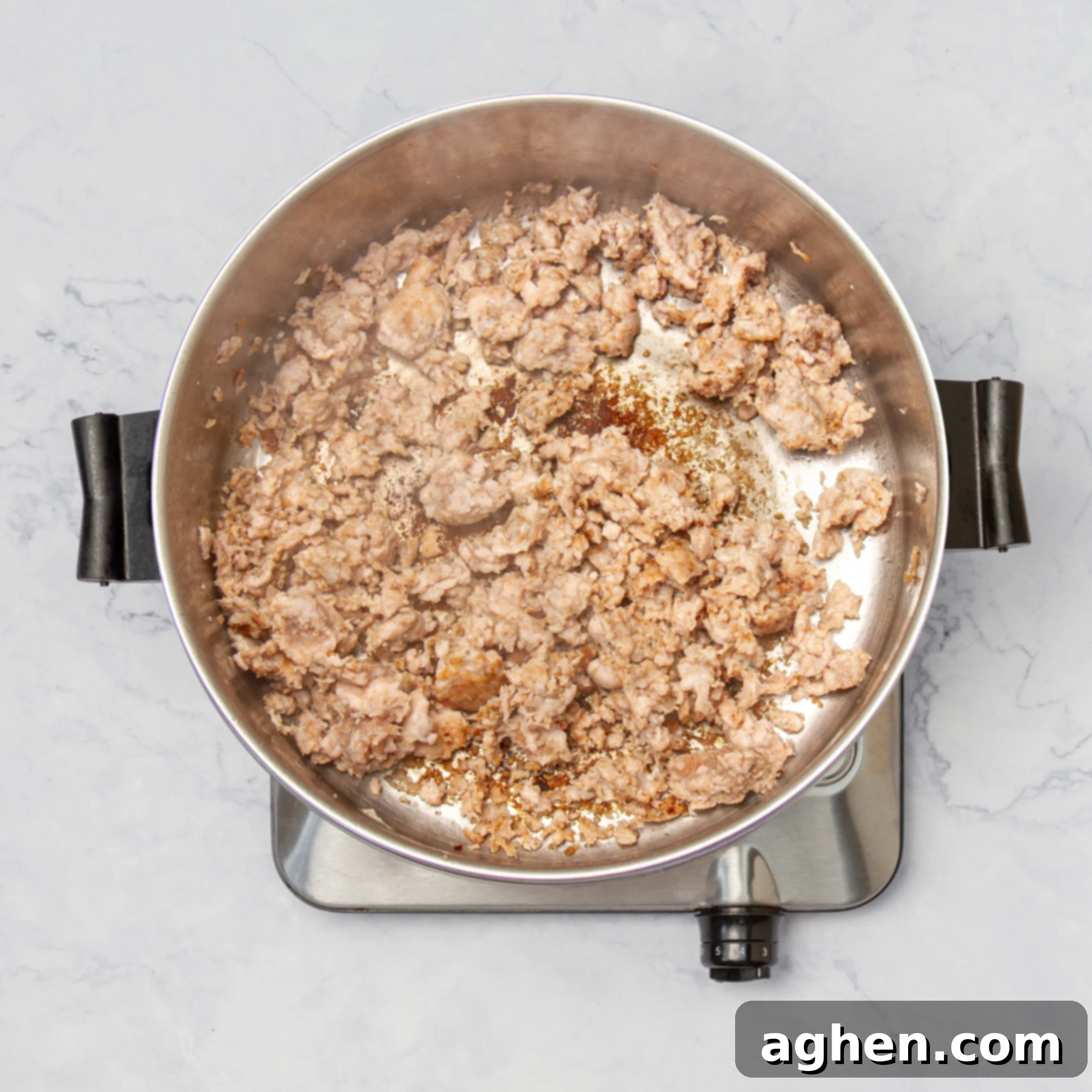 Weight Watchers Turkey Taco Soup: A Fall Favorite 4 Ground turkey browning in a large pot, being broken apart with a wooden spoon.