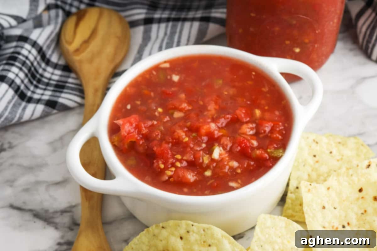 Rotel salsa dip served with tortilla chips, perfect for parties