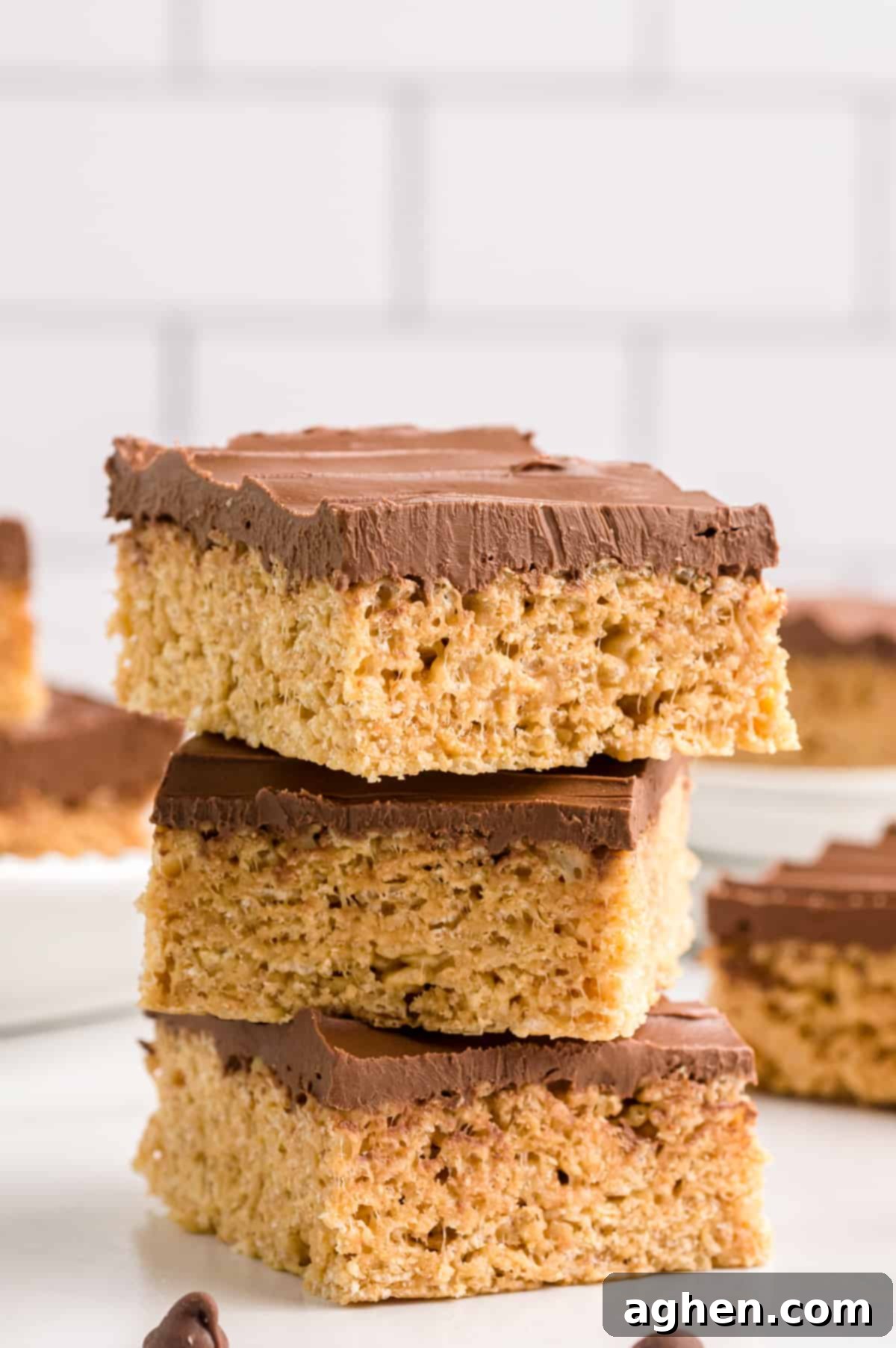 Three peanut butter cereal bars stacked off center.