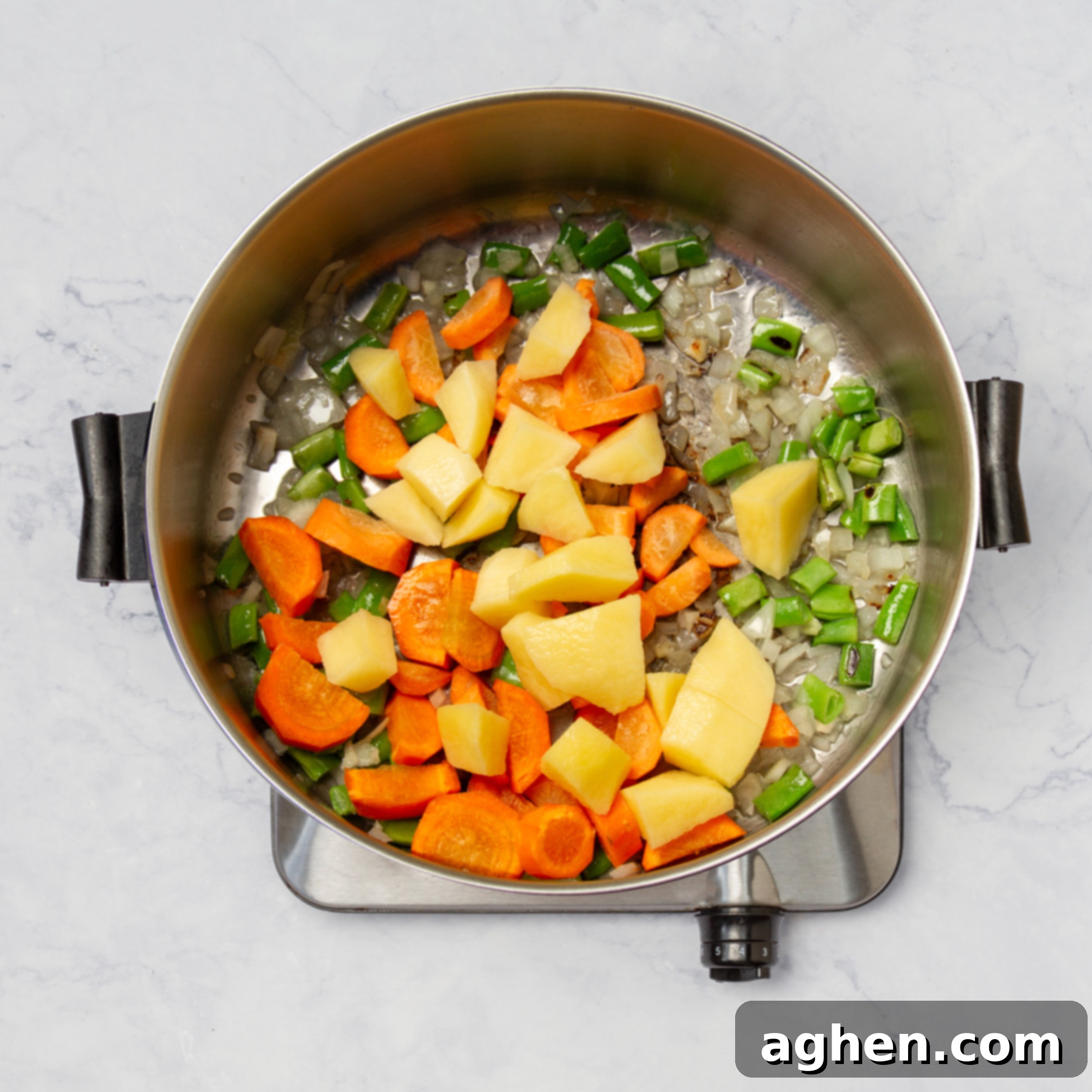 Restaurant-Quality Cod Chowder, Surprisingly Simple 4 Aromatics and vegetables sautéing in a pot.