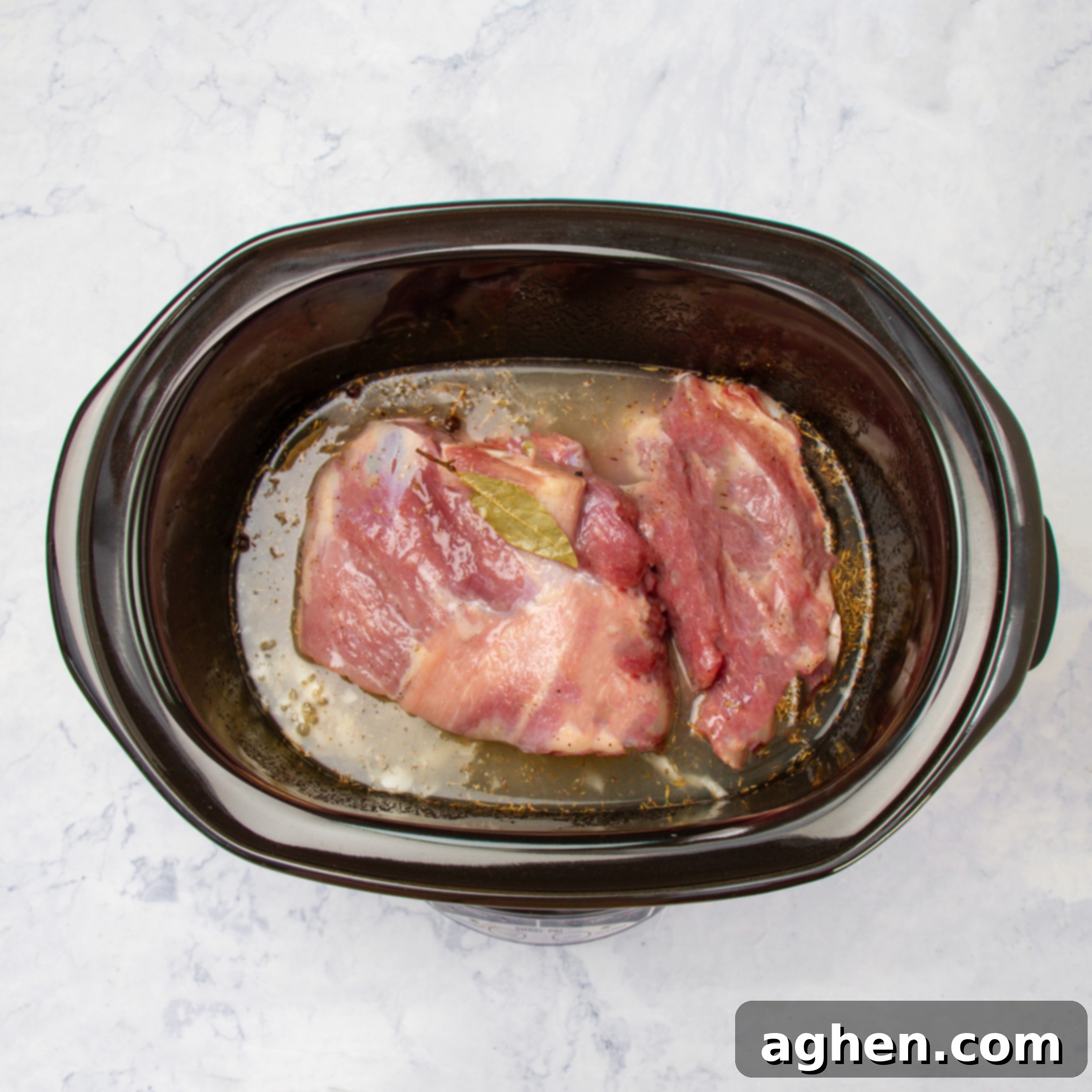 Broth added to the other ingredients in the slow cooker. 