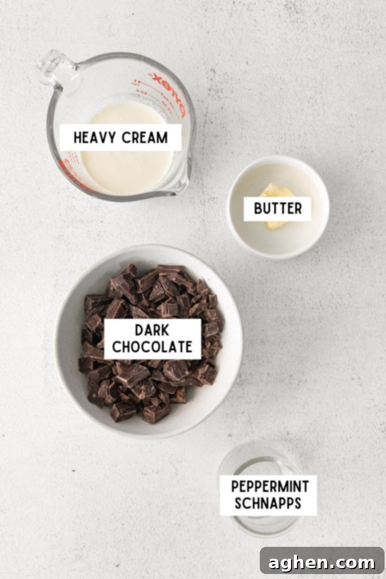 heavy cream, chopped dark chocolate, butter, and peppermint schnapps in bowls on countertop