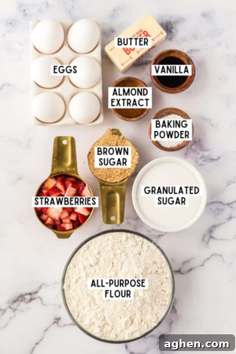 A curated display of all the essential ingredients for making strawberry shortcake cookies: fresh eggs, softened butter, vanilla extract, almond extract, rich brown sugar, granulated sugar, vibrant fresh strawberries, baking powder, and all-purpose flour.
