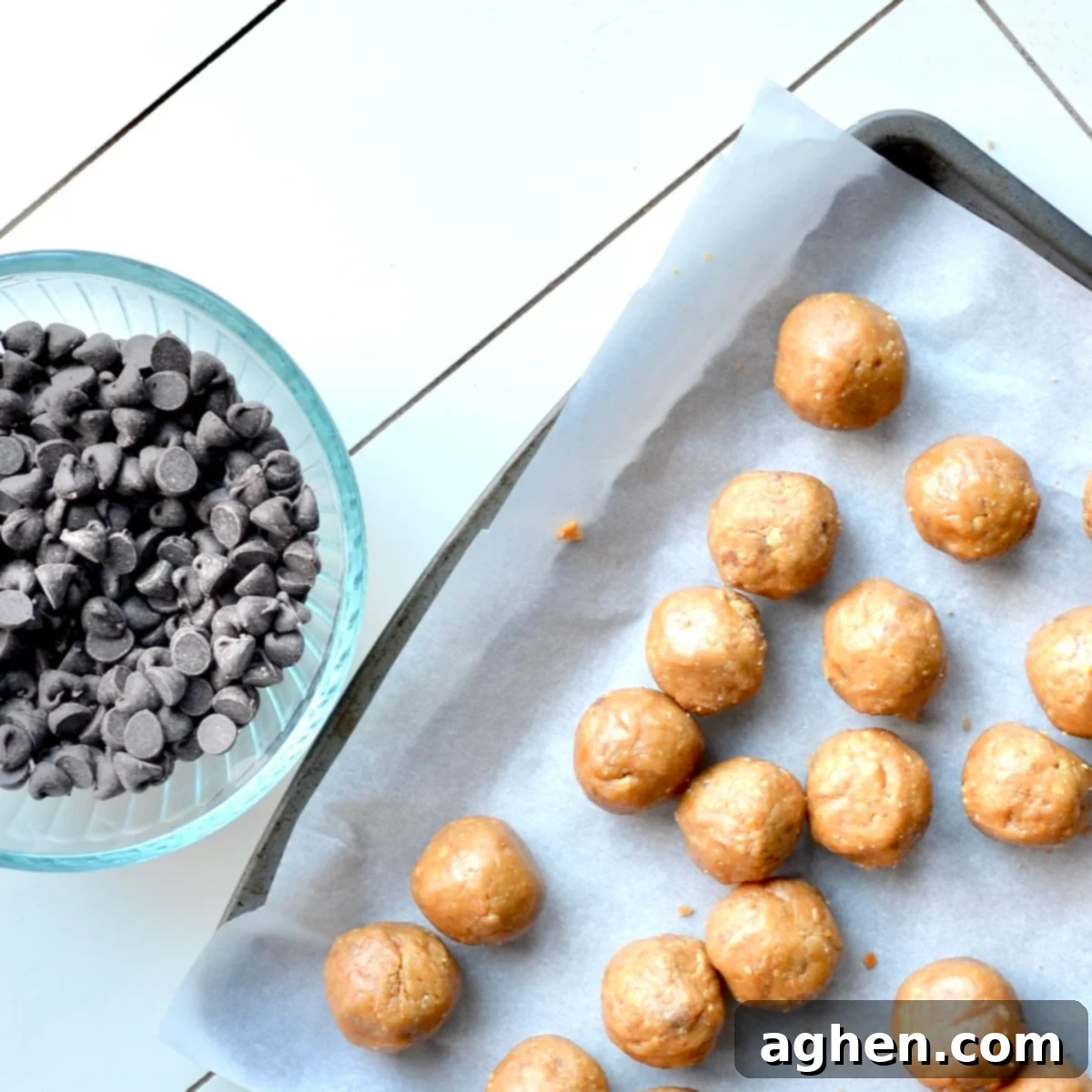 Unadorned Butterfinger balls neatly arranged on a tray before chocolate coating