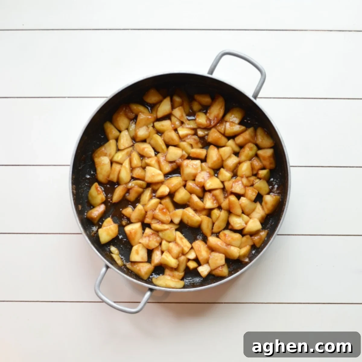 Apple pie filling simmering in a pot