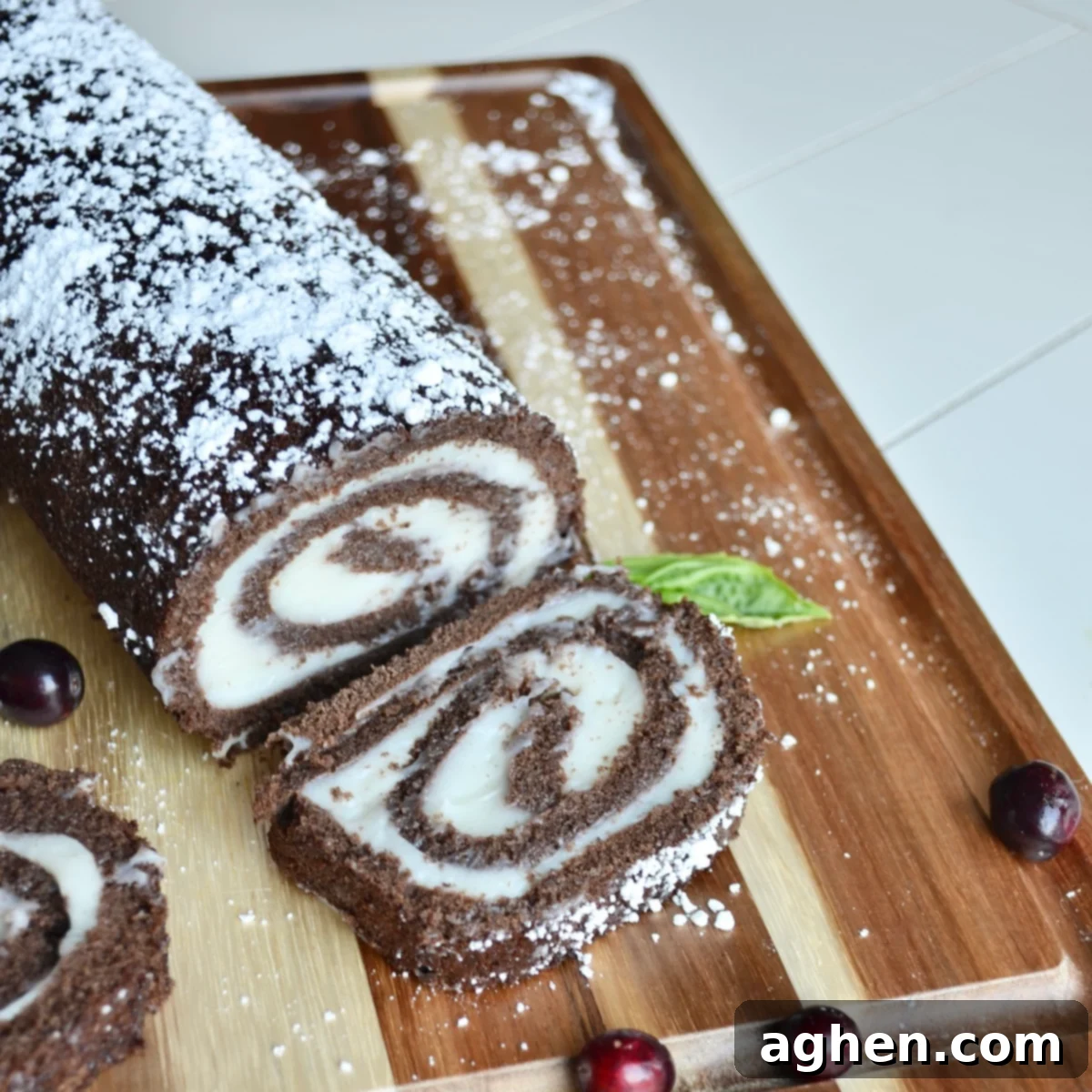 Festive Weight Watchers Swiss Roll garnished with cranberries and mint